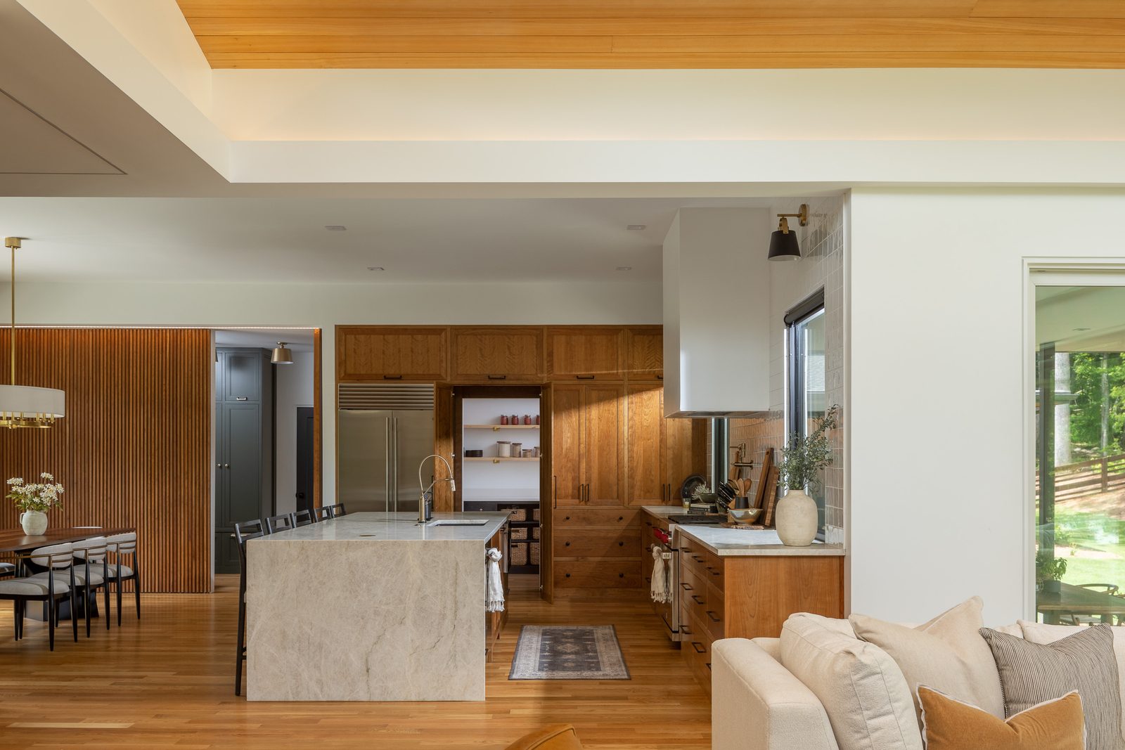 Kitchen open to the living room — The Ortiz Home, custom home built by Ironwood Construction Group in Sugar Hill, Georgia
