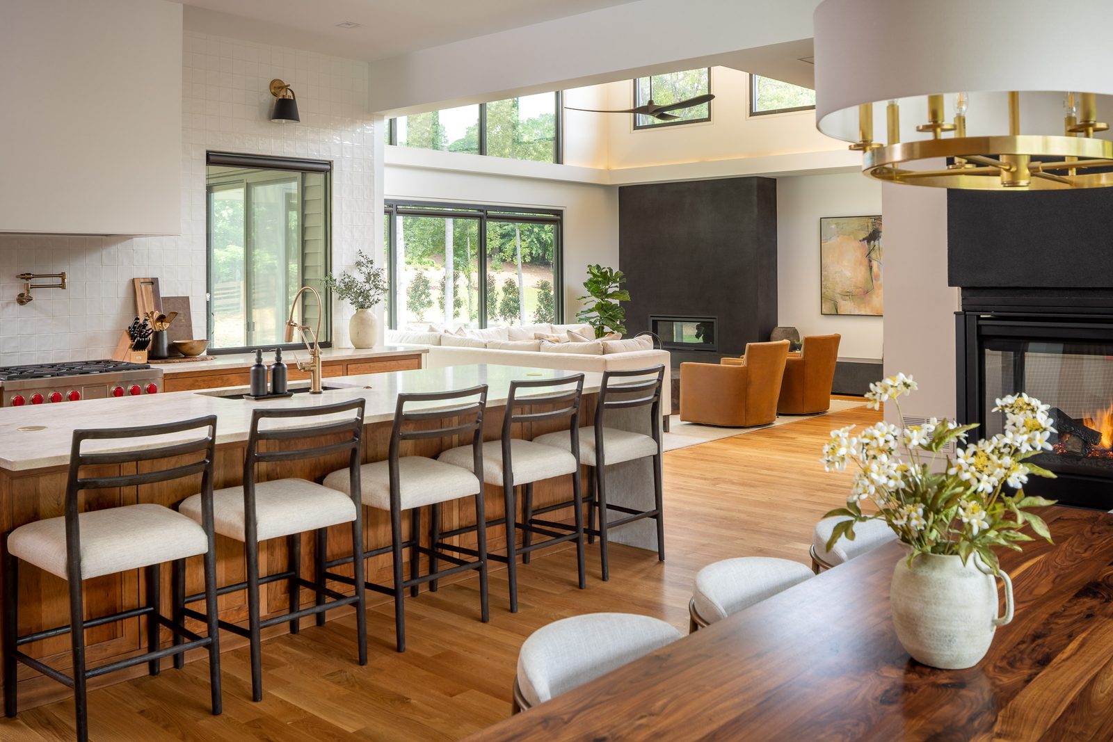 Kitchen island with barstools beside the dining table — The Ortiz Home, custom home built by Ironwood Construction Group in Sugar Hill, Georgia