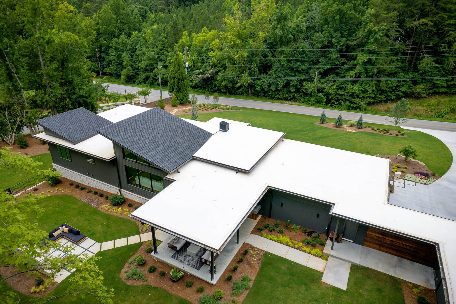 Aerial view of the roofline and rear yard — The Ortiz Home, custom home built by Ironwood Construction Group in Sugar Hill, Georgia